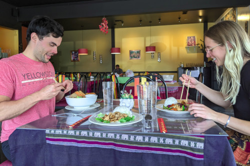 Happy couple enjoying PD Thai food